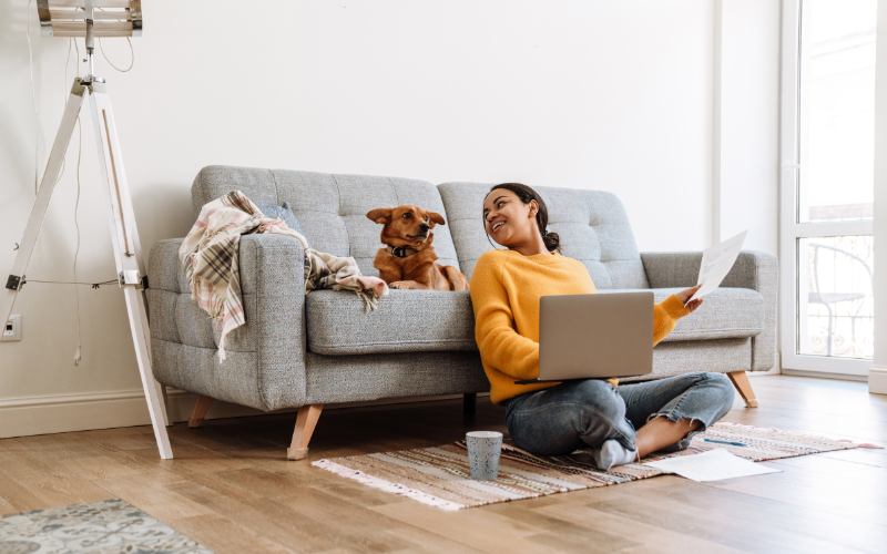 1 woman and dog on the computer